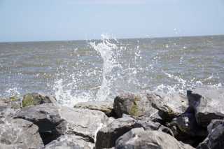 Dauphin Island at Fort Gaines - waves spashing on jetty
